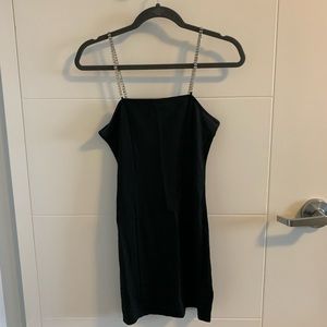 Divided rhinestone strapped black mini dress